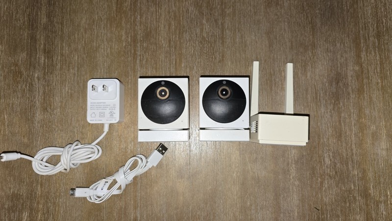 2 WYZE CAM outdoor wireless cameras and 1 base station