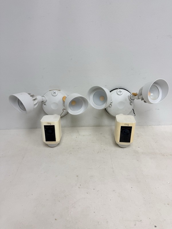 Lot of 2 – Ring Wired Outdoor Floodlight Cameras in White. FOR PARTS, DON’T WORK