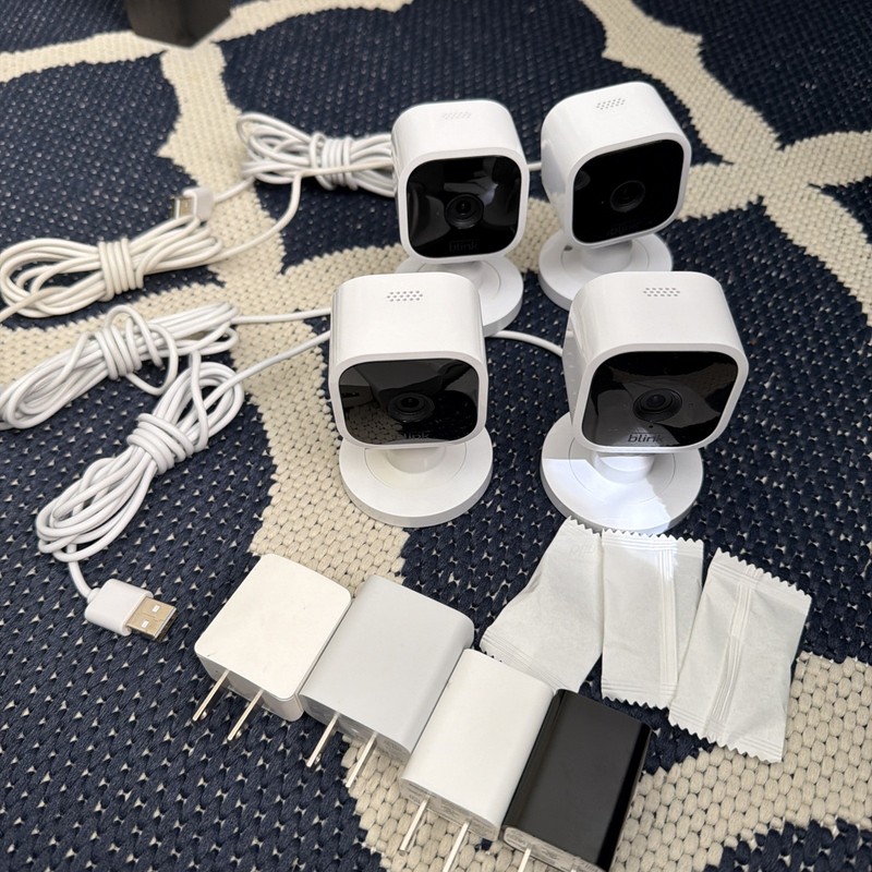 Quantity 4 Blink Mini Indoor Plug-In HD Smart Security Camera + Mounts Chargers