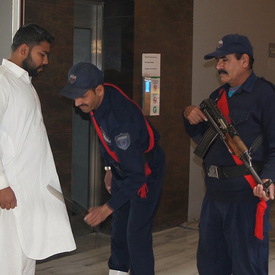 Veteran Security & Protection (Pvt) Ltd security guards performing security duties at entry point of an office door